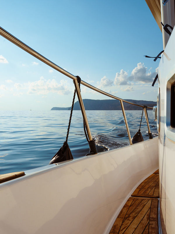 deck-of-white-yacht-sailing